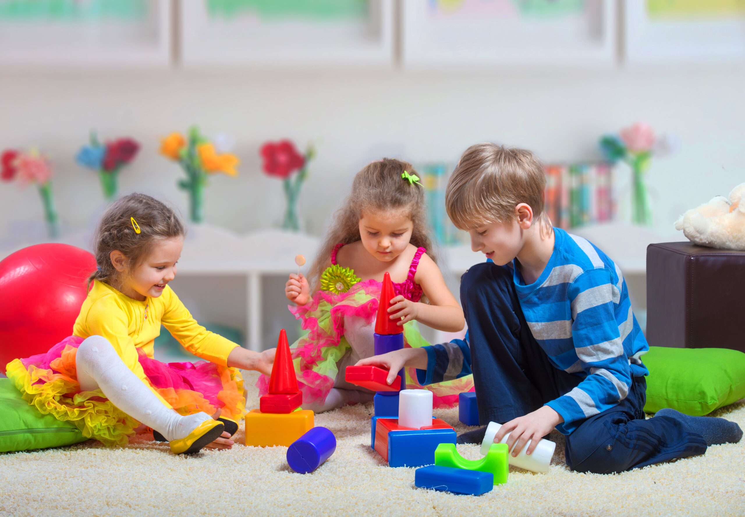 preteen-boy-playing-with-two-younger-girls-min